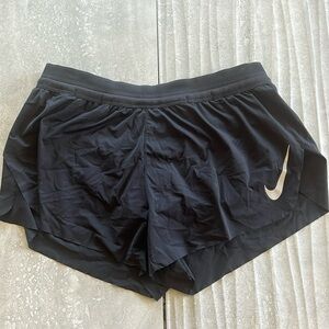 Women’s black Nike AeroSwift shorts.
